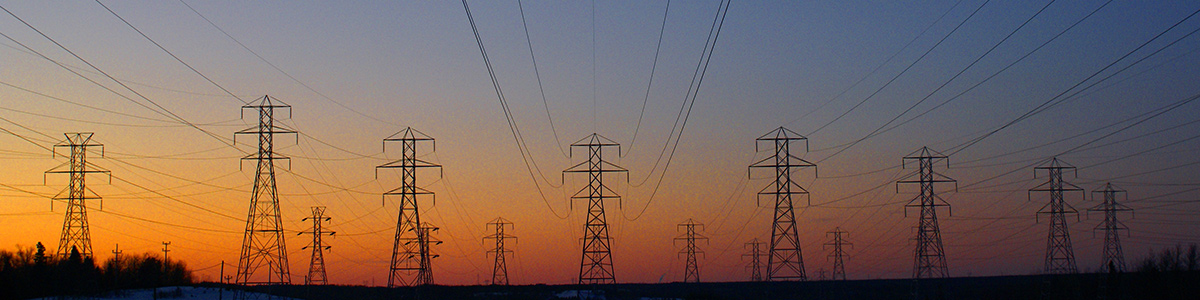 Eight rows of overhead power lines during late dusk