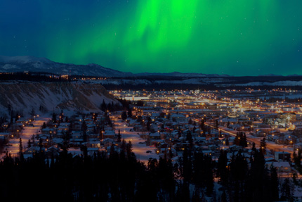 Aurora borealis over downtown Whitehorse during winter